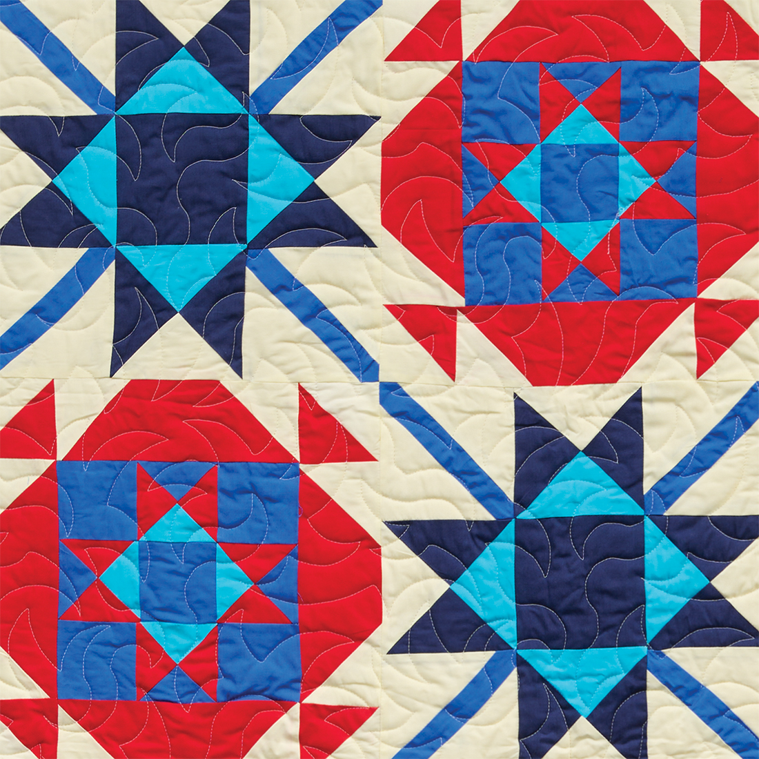 Fireworks quilt block in red, white, and blue fabrics.
